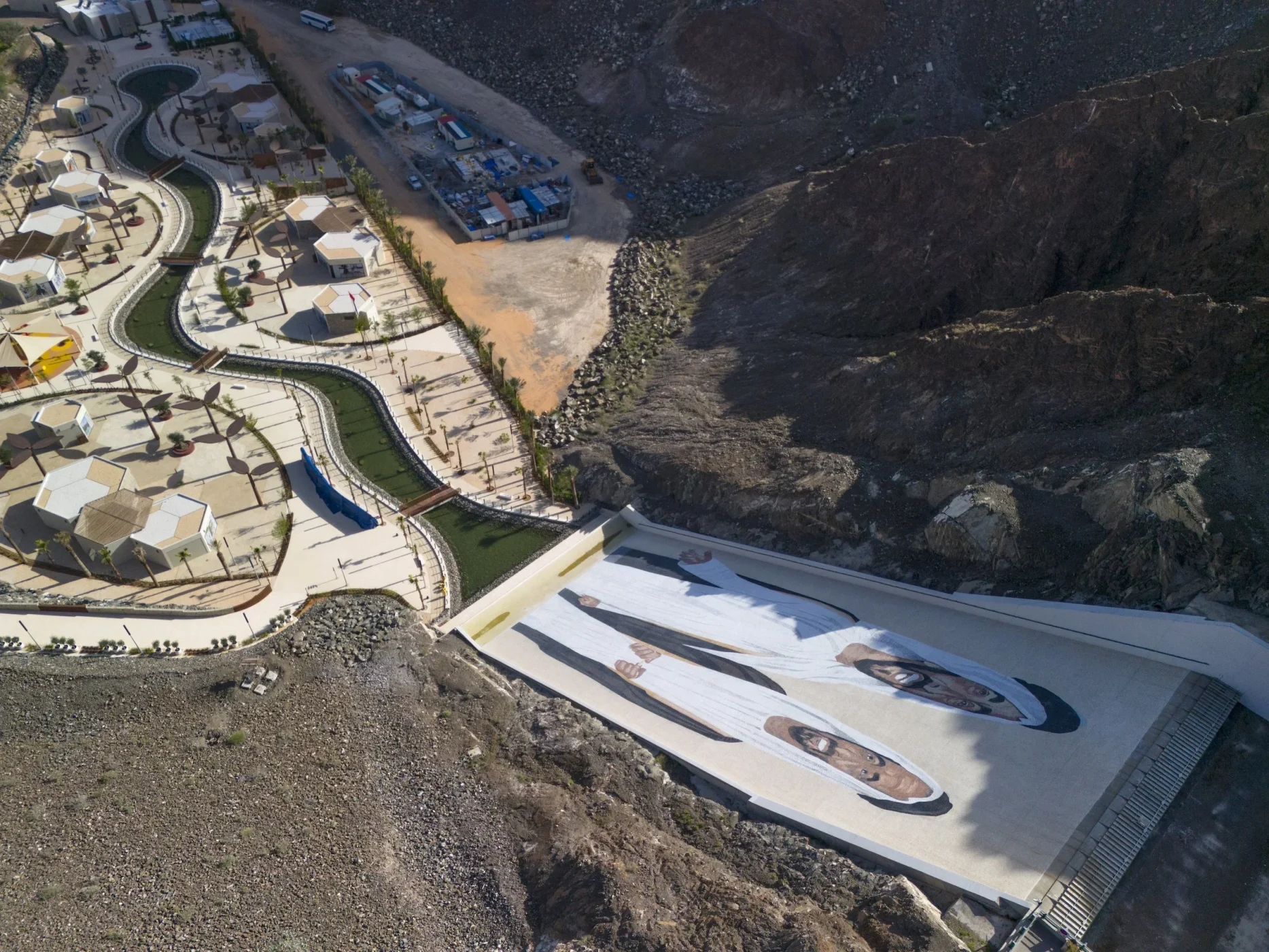 Aerial view of the marble portrait mosaic on Hatta Dam’s spillway