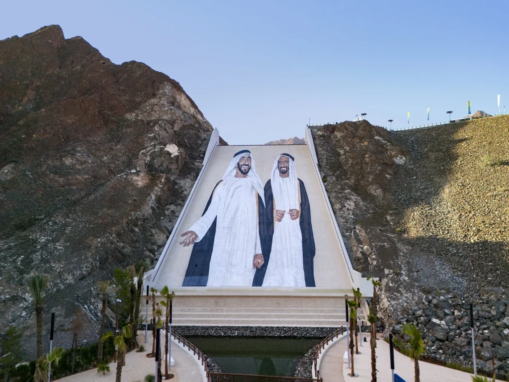 The two portraits seen from the base of the spillway